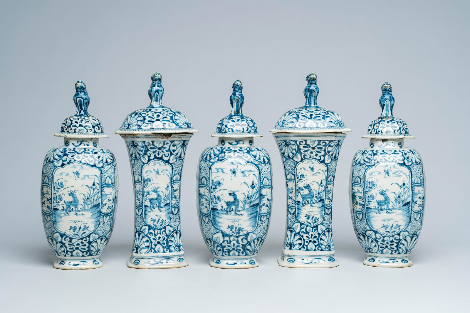 A Dutch Delft blue and white five-piece vase garniture with animals in a landscape, 18th C.: Full title: A Dutch Delft blue and white five-piece vase garniture with animals in a landscape, 18th C. Description: H 36,7 - 34,8 cm (the tallest and the smallest vase) The absence of a condition rep