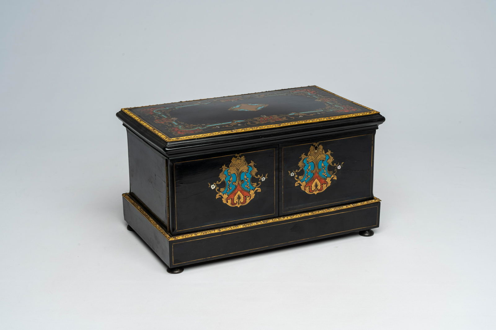 A French Historicism bronze mounted ebonised wooden tortoiseshell, mother-of pearl and brass