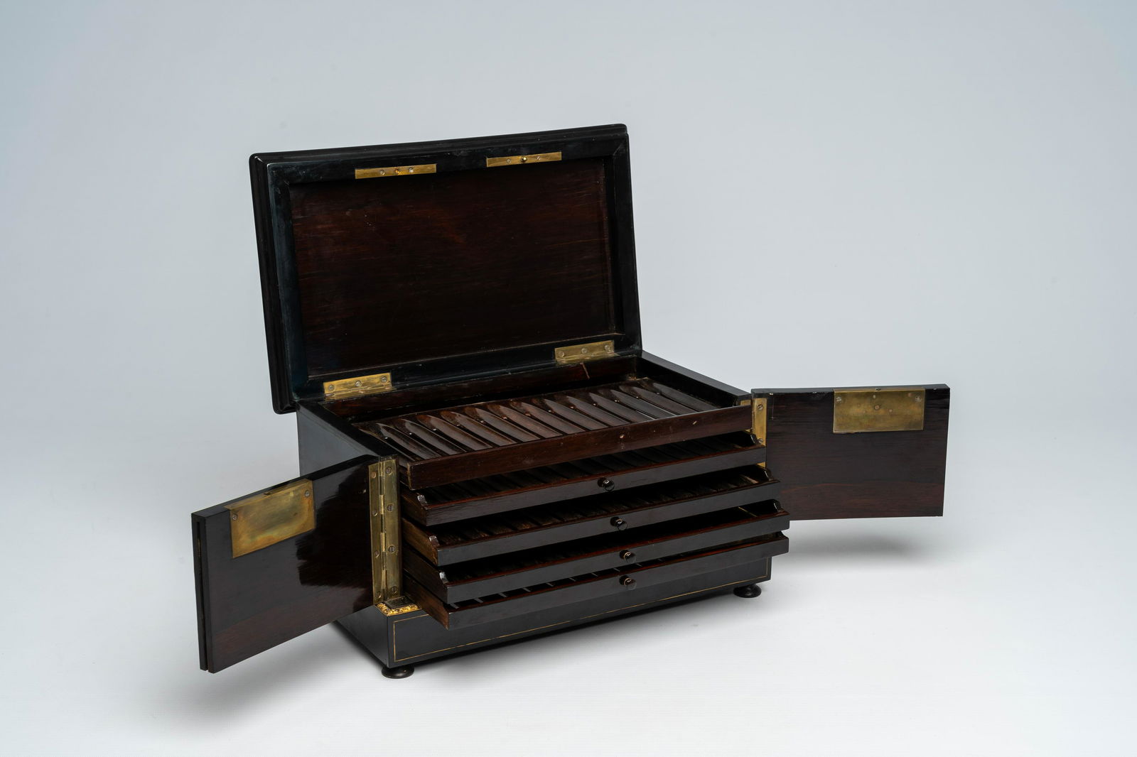 A French Historicism bronze mounted ebonised wooden tortoiseshell, mother-of pearl and brass
