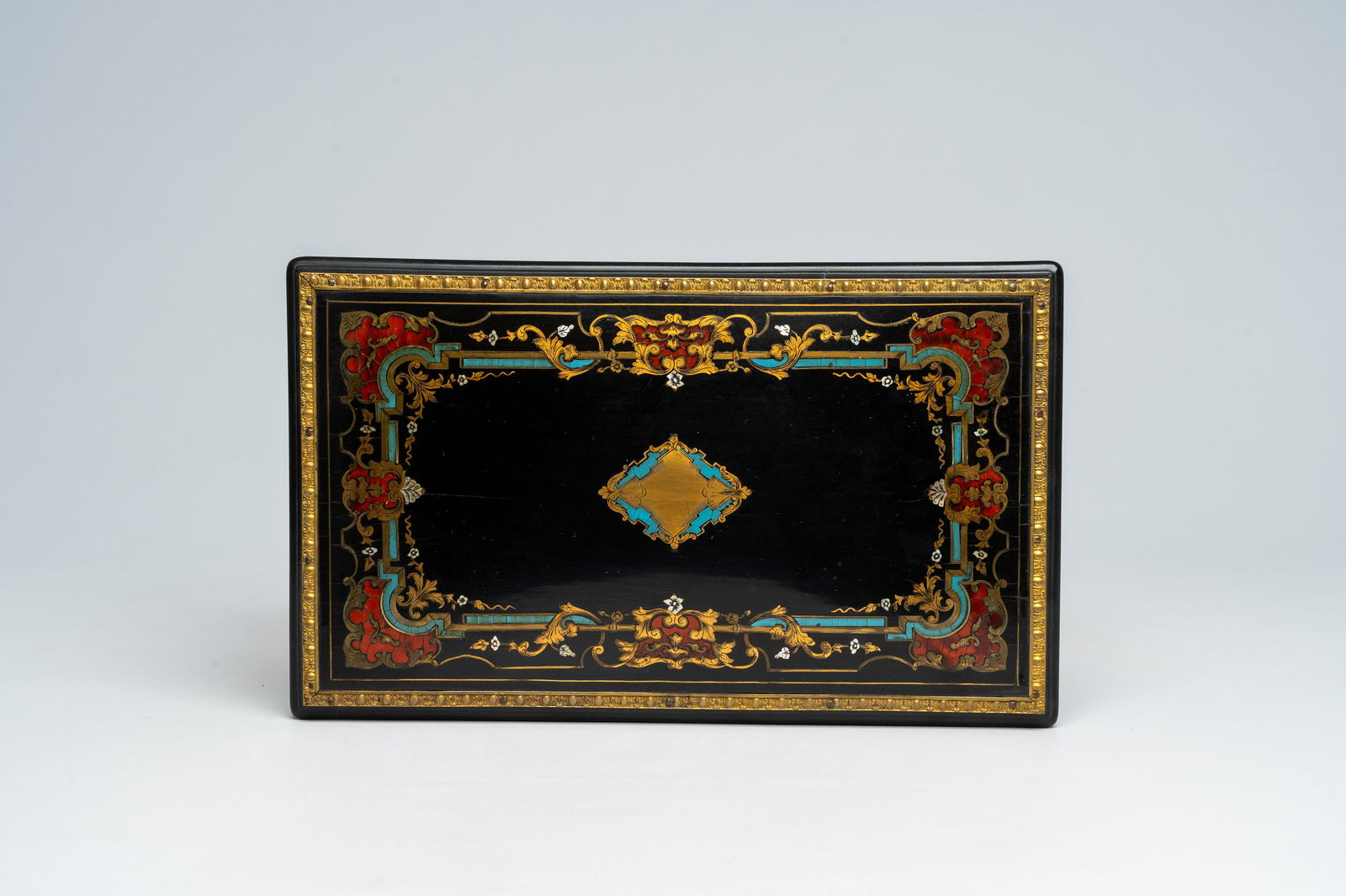 A French Historicism bronze mounted ebonised wooden tortoiseshell, mother-of pearl and brass