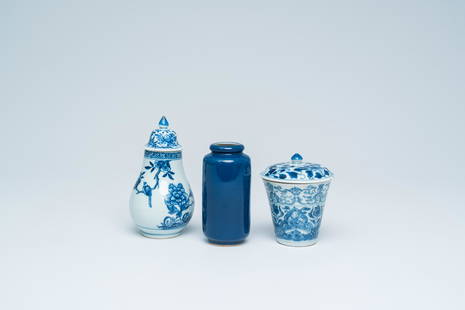 A Chinese blue and white covered cup, a covered vase and a small monochrome blue rouleau vase,: Full title: A Chinese blue and white covered cup, a covered vase and a small monochrome blue rouleau vase, Kangxi and later Description: H 13,5 - 10 cm (the tallest and the smallest item)