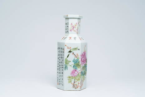 A hexagonal Chinese qianjiang cai vase with an animated landscape and a bird on a blossoming branch,: Title: A hexagonal Chinese qianjiang cai vase with an animated landscape and a bird on a blossoming branch, Kangxi mark, 19th/20th C. Description: H 45,4 cm