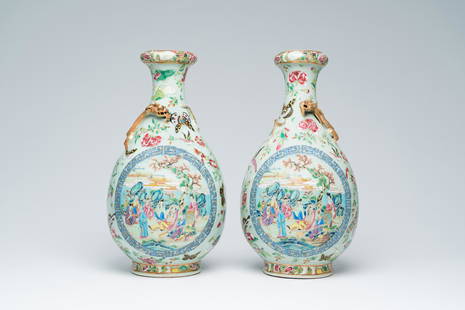 A pair of Chinese Canton famille rose celadon ground 'Eight Immortals' vases with a palace scene and: Title: A pair of Chinese Canton famille rose celadon ground 'Eight Immortals' vases with a palace scene and butterflies, 19th C. Description: H 43 - 42,5 cm