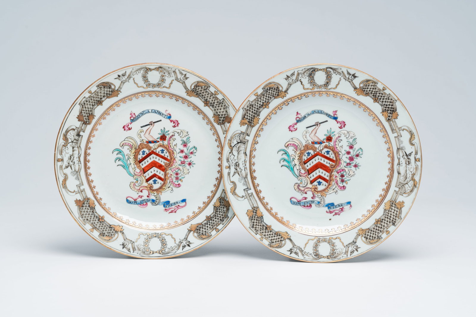 A pair of Chinese famille rose and grisaille Irish market 'Minchin' armorial plates, Qianlong: Full title: A pair of Chinese famille rose and grisaille Irish market 'Minchin' armorial plates, Qianlong Description: Dia.: 22,7 cm Ref.: - A similar plate depicted in D. Howard, Chinese Armorial Por