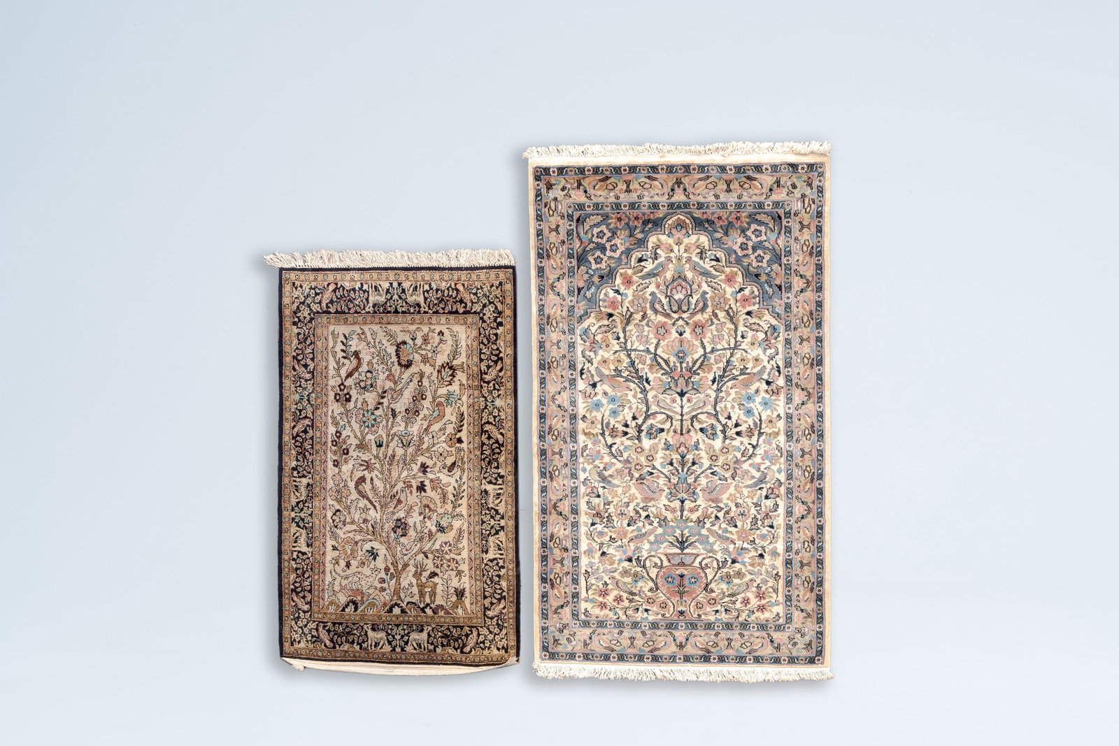 Two Persian Goum and Isfahan 'Tree of Life' rugs, wool and silk on cotton, Iran, 20th C.: Full title: Two Persian Goum and Isfahan 'Tree of Life' rugs, wool and silk on cotton, Iran, 20th C. Description: 157,5 x 93 cm 126 x 77 cm Condition reports and high resolution pictures are available