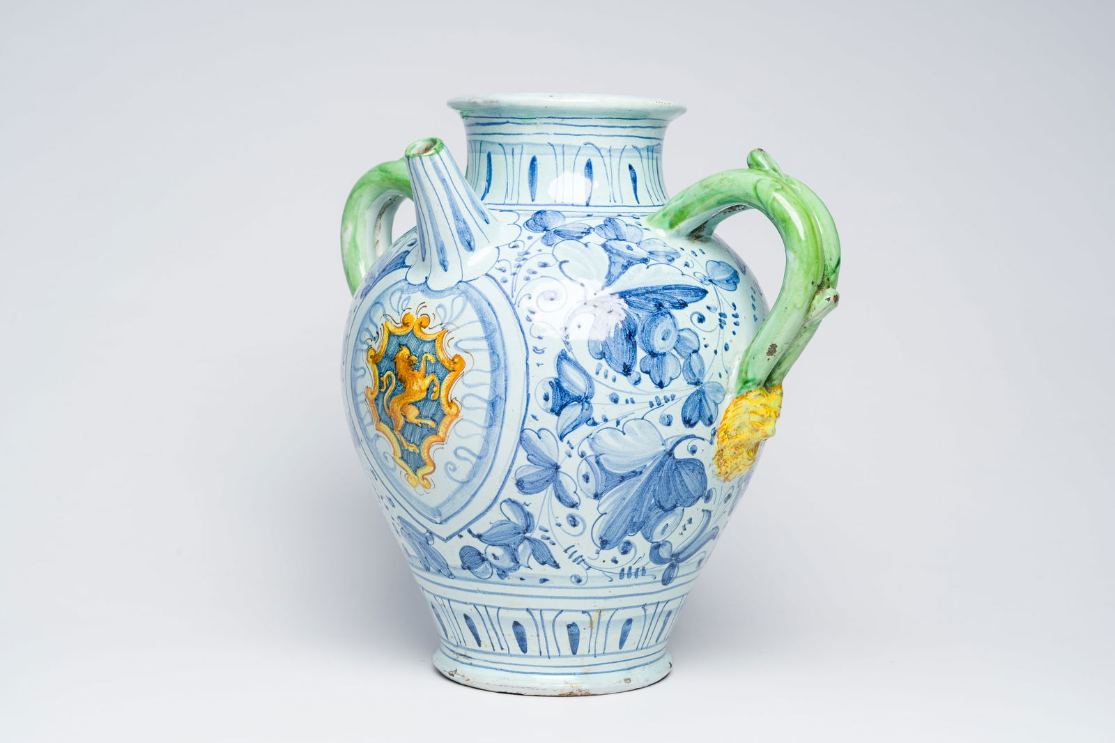A large Italian polychrome maiolica pharmacy jar with a coat of arms and floral design, possibly (1 of 7)