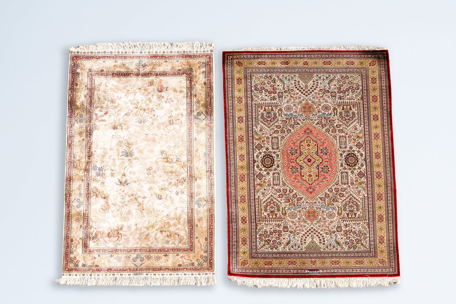 Two Persian silk rugs with floral design and a hunting scene, Iran, 20th C. (1 of 8)