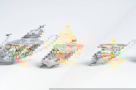 A Chinese Canton famille rose three-part tea set with palace scenes, 19th C.: A Chinese Canton famille rose three-part tea set with palace scenes, 19th C. H 19 - L 27,7 cm (the teapot and cover) H 13 cm - Dia.: 14,5 cm (the sugar bowl) H 10,8 - L 17 cm (the milk jug)