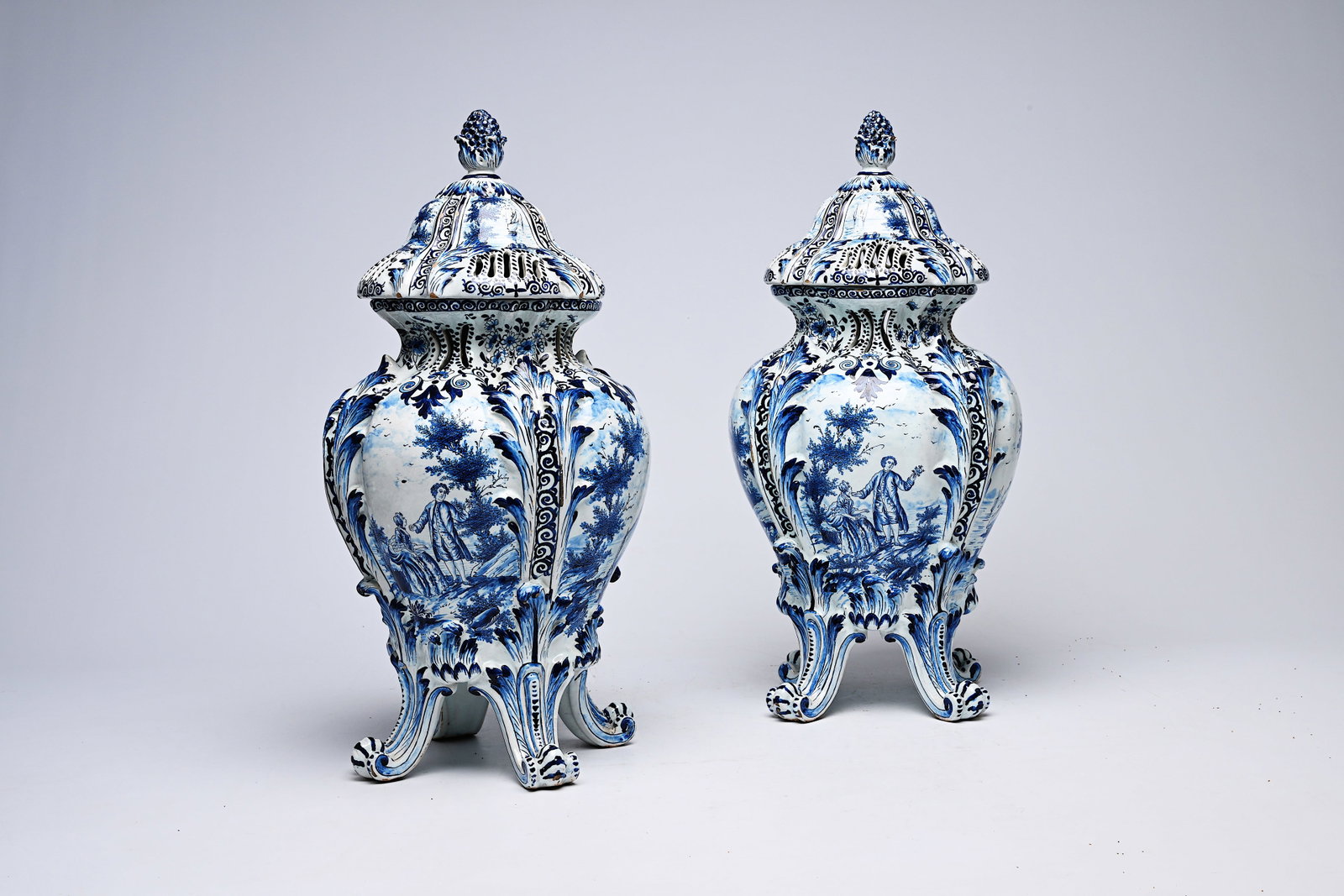 A pair of Delft pot-pourri vases and covers with landscapes and romantic scenes, possibly Northern: A pair of Delft pot-pourri vases and covers with landscapes and romantic scenes, possibly Northern France, ca. 1900 H 56,5 cm