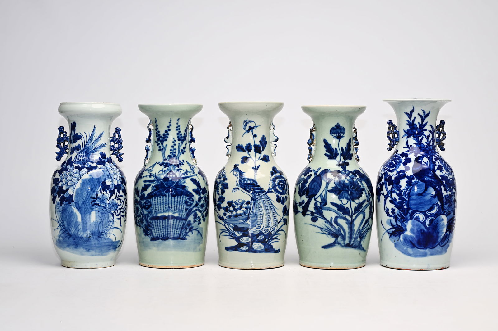 Five Chinese blue and white celadon ground vases with birds among blossoming branches and floral: Five Chinese blue and white celadon ground vases with birds among blossoming branches and floral design, 19th/20th C. H 43,7 - 42,3 cm (the tallest and the smallest vase)