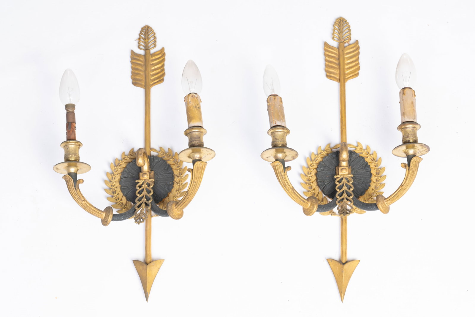 A pair of French Empire-style gilt and patinated bronze two-armed wall lighting appliques, 19th/20th: A pair of French Empire-style gilt and patinated bronze two-armed wall lighting appliques, 19th/20th C. H 53 - L 27 cm