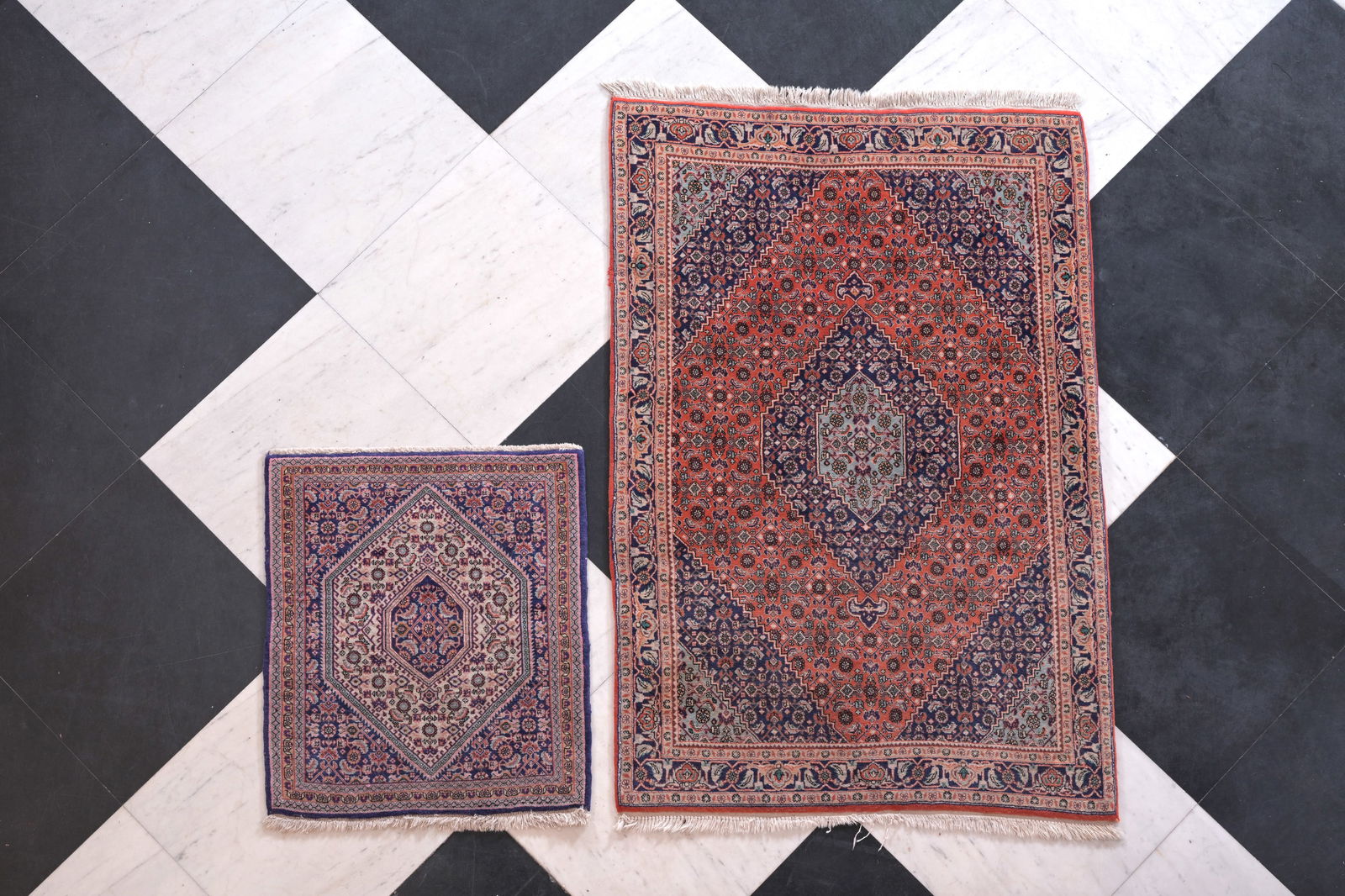 Two Persian Bidjar rugs with floral design, wool on cotton, 20th C. (1 of 10)