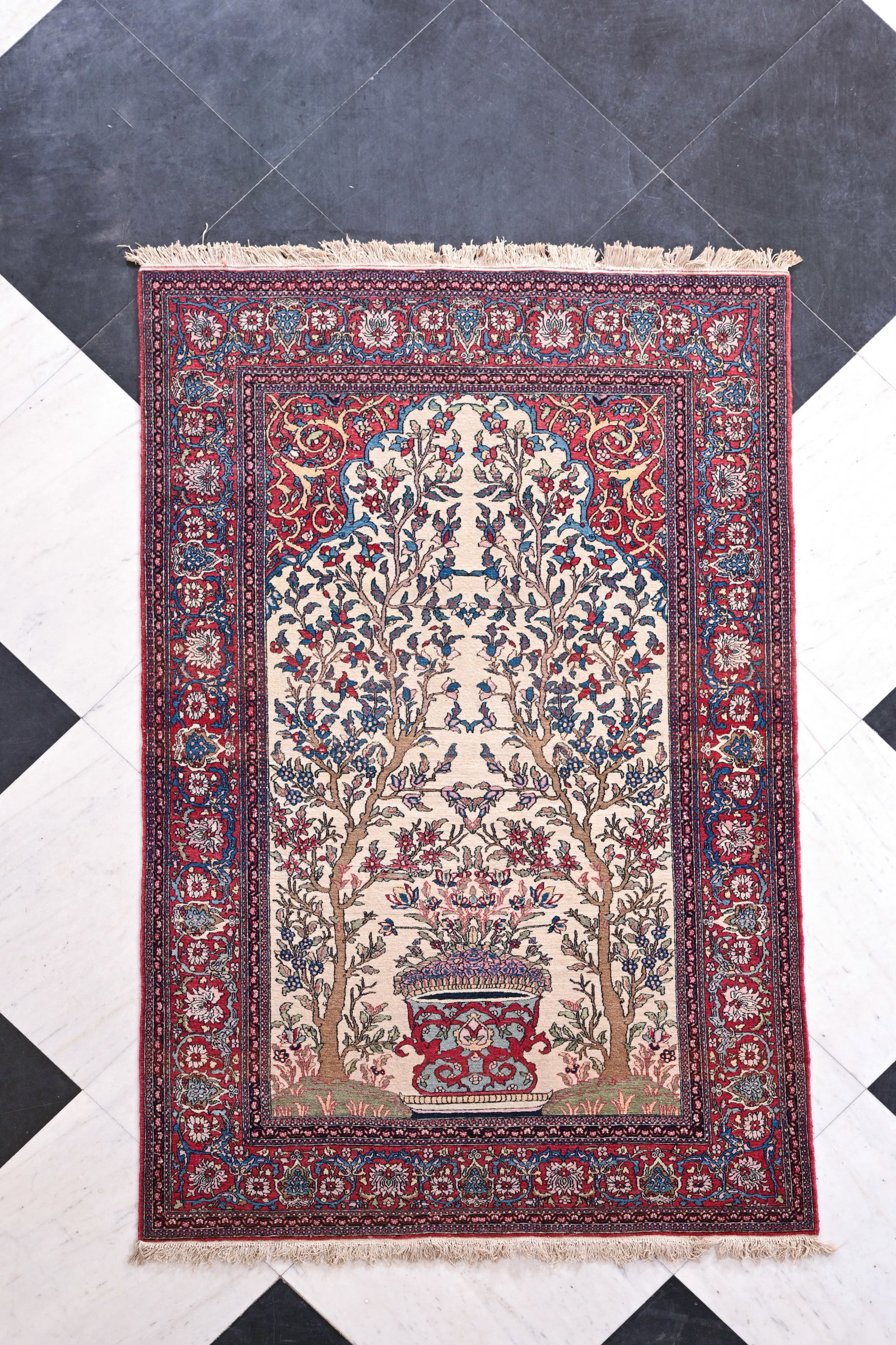 A Persian Isfahan rug with trees of life, wool on cotton, third quarter 20th C.: A Persian Isfahan rug with trees of life, wool on cotton, third quarter 20th C. 213 x 136 cm