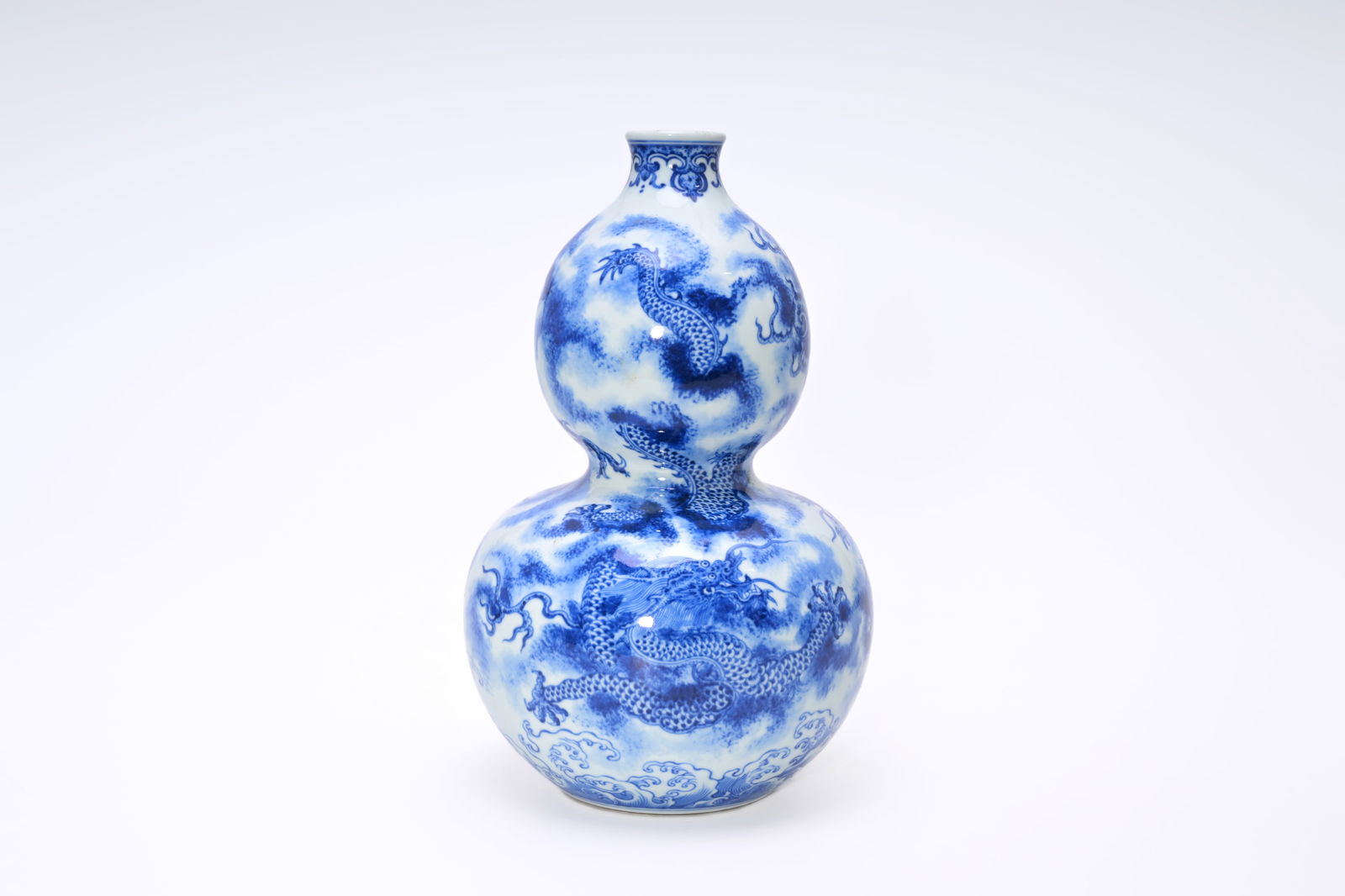A Chinese blue and white double gourd vase with dragons, Qianlong mark but probably later (1 of 6)