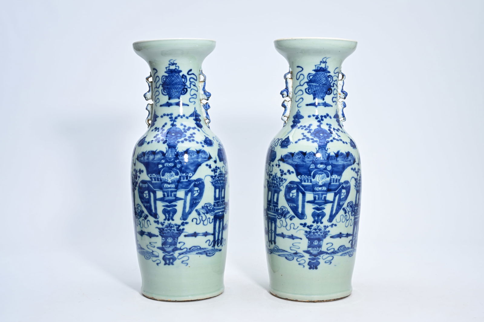 A pair of Chinese blue and white celadon ground 'antiquities' vases, 19th/20th C. (1 of 6)