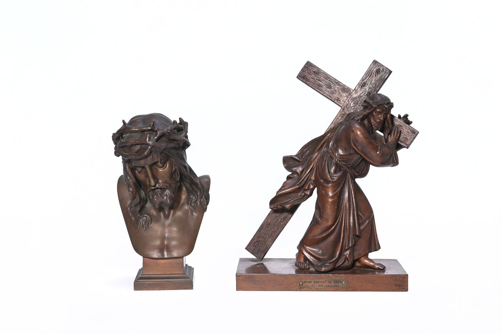 Eugène Marioton (1854-1933): Bust of Christ and Eugène Laurent (1832-1898): Christ carrying the: Eugène Marioton (1854-1933): Bust of Christ and Eugène Laurent (1832-1898): Christ carrying the cross, brown patinated bronze H 29,5 - 23 cm The bust with the number 'B228'.