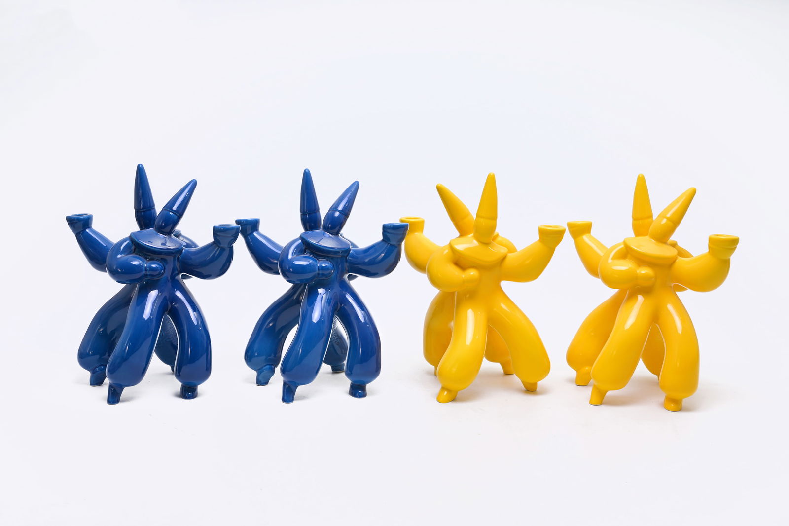 Jean Boggio (1963): Four yellow and blue glazed earthenware dancing harlequins-shaped 'Korrigans' (1 of 9)