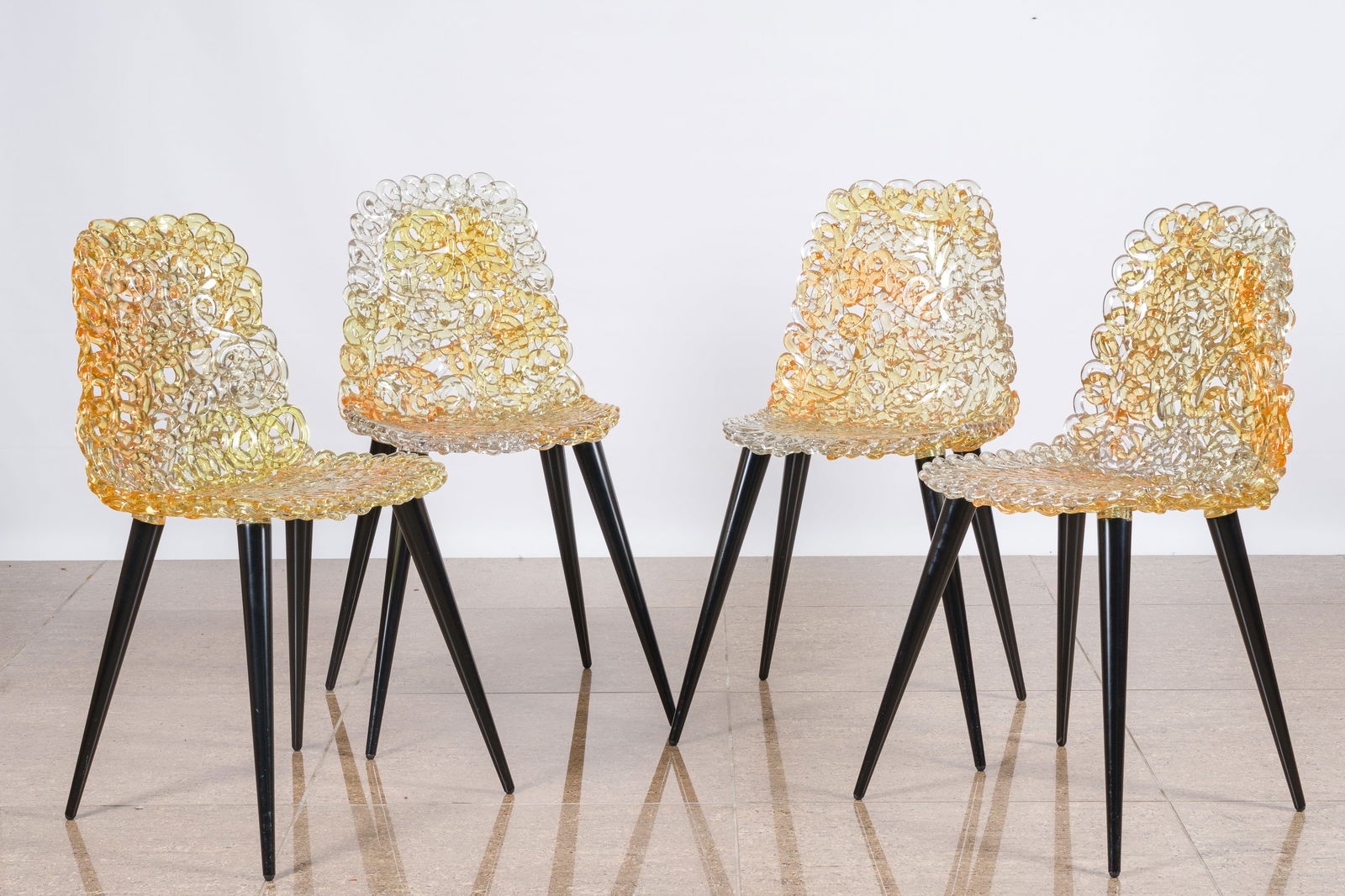Jacopo Foggini (1966): Four gold and amber coloured 'Gina' chairs for Edra, polycarbonate and wood (1 of 7)