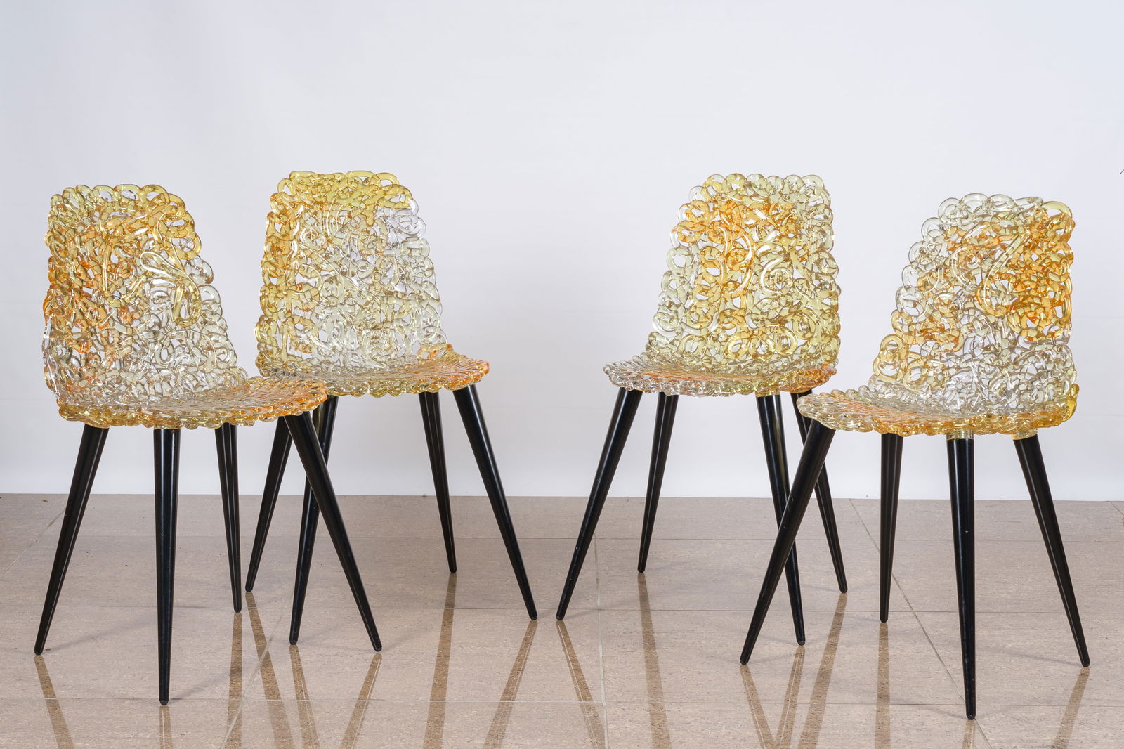 Jacopo Foggini (1966): Four gold and amber 'Gina' chairs for Edra, polycarbonate and wood (1 of 7)