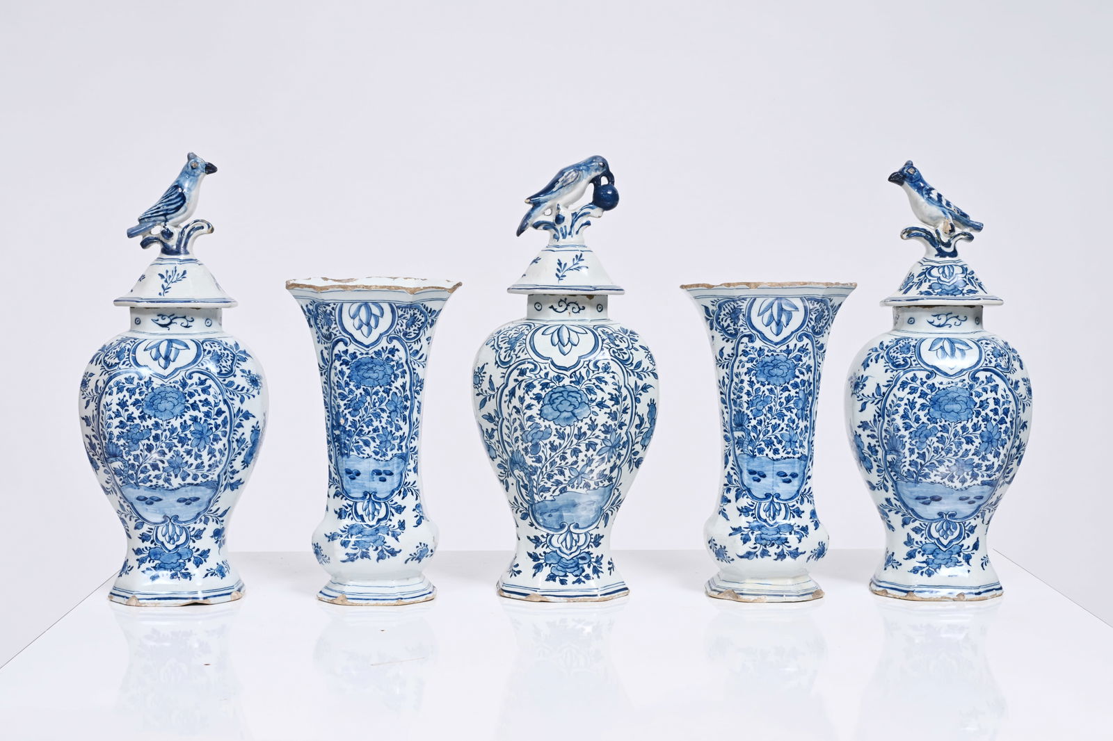 A five-piece Dutch Delft blue and white vase garniture with floral design, 18th C.: A five-piece Dutch Delft blue and white vase garniture with floral design, 18th C. H 37,5 - 26,5 cm