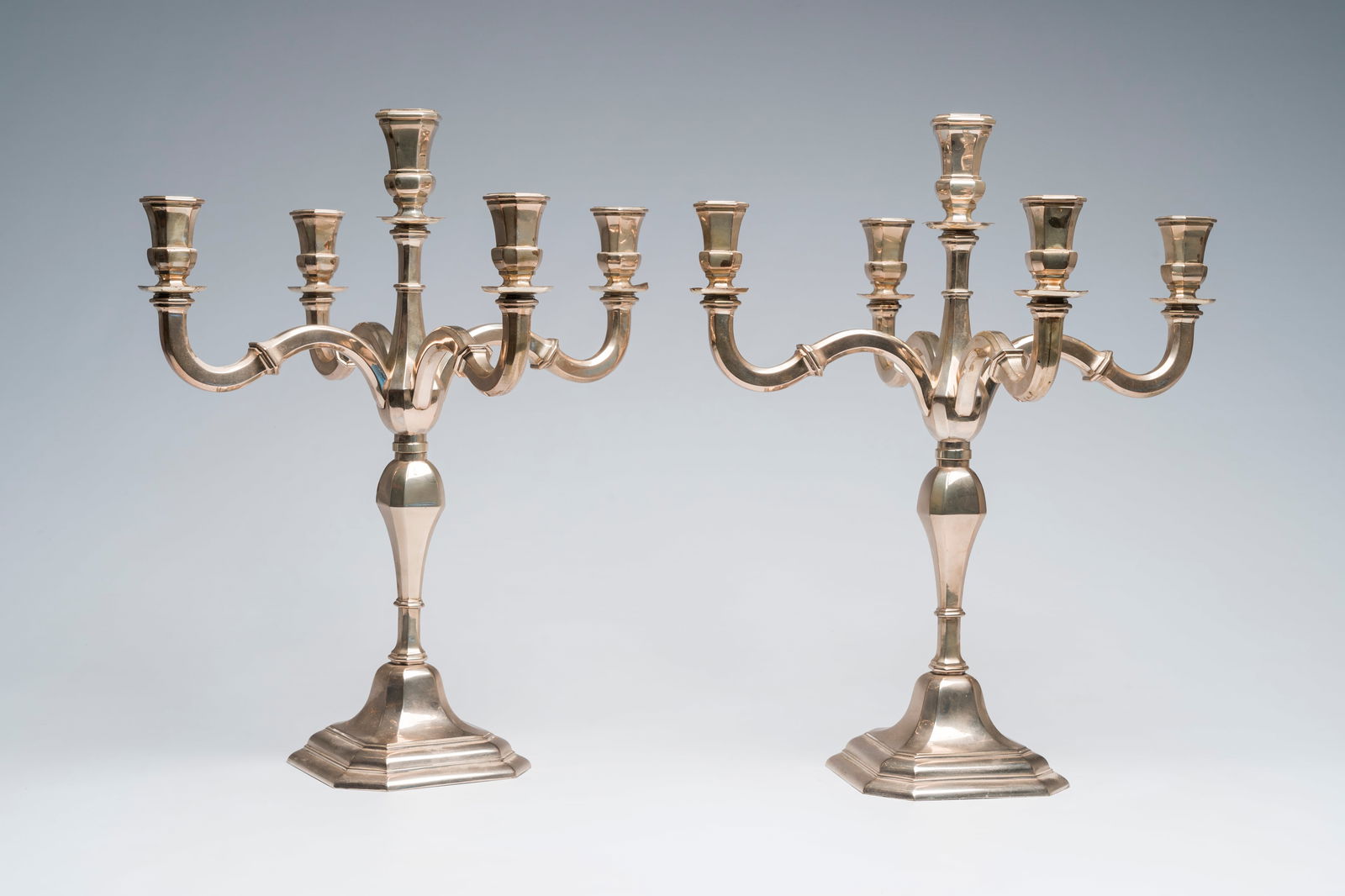A pair of Louis XIV style five-light silver candlesticks, 800/000, 20th C. (1 of 9)