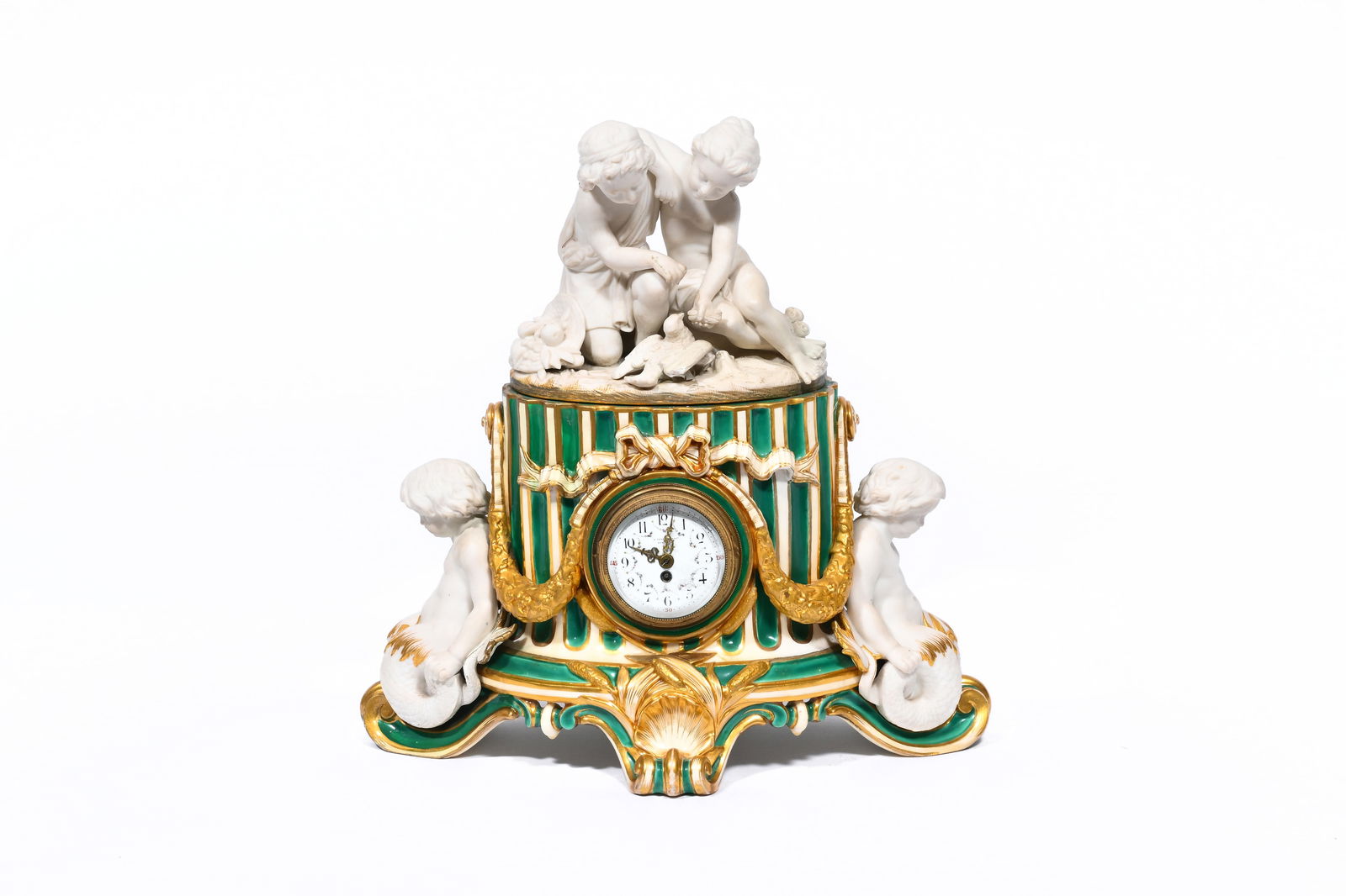 An English Minton partly gilt porcelain and biscuit 'fluted column' mantel clock with an allegorical (1 of 8)