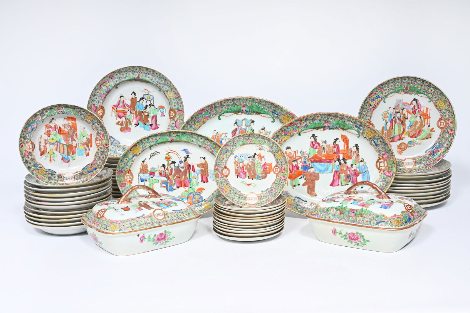 An extensive Chinese Canton famille rose service with monogram medallions, 19th C.