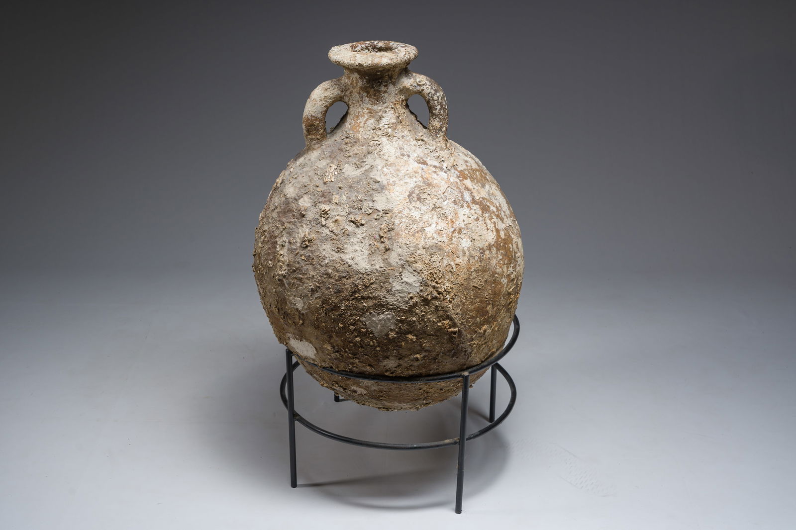 A large Roman rounded terracotta oil amphora of the 'Dressel 20' type, 1st-3rd C.: A large Roman rounded terracotta oil amphora of the 'Dressel 20' type, 1st-3rd C. H 87 - 76 cm (with and without base)