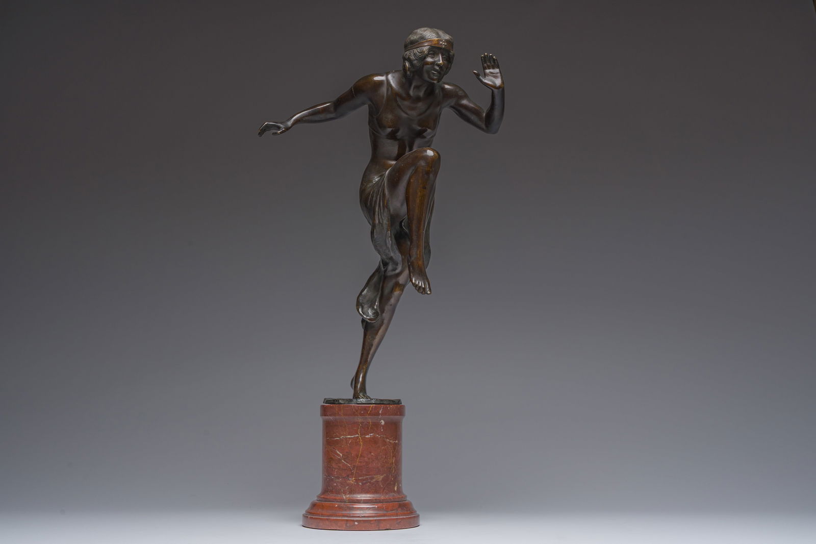 Rudolf Marcuse (1878-1940, attributed to): Dancer, patinated bronze on a red marble base: Rudolf Marcuse (1878-1940, attributed to): Dancer, patinated bronze on a red marble base H 60,5 - 45,5 cm (with and without base) The base of the sculpture inscribed 'D38'.