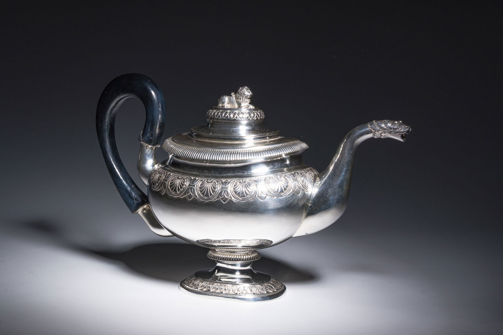 A fine Danish Empire silver teapot crowned with a lion, maker's mark Jens Jensen, Copenhagen, dated: A fine Danish Empire silver teapot crowned with a lion, maker's mark Jens Jensen, Copenhagen, dated 1839 H 18 - L 28 cm Weight: 512 g