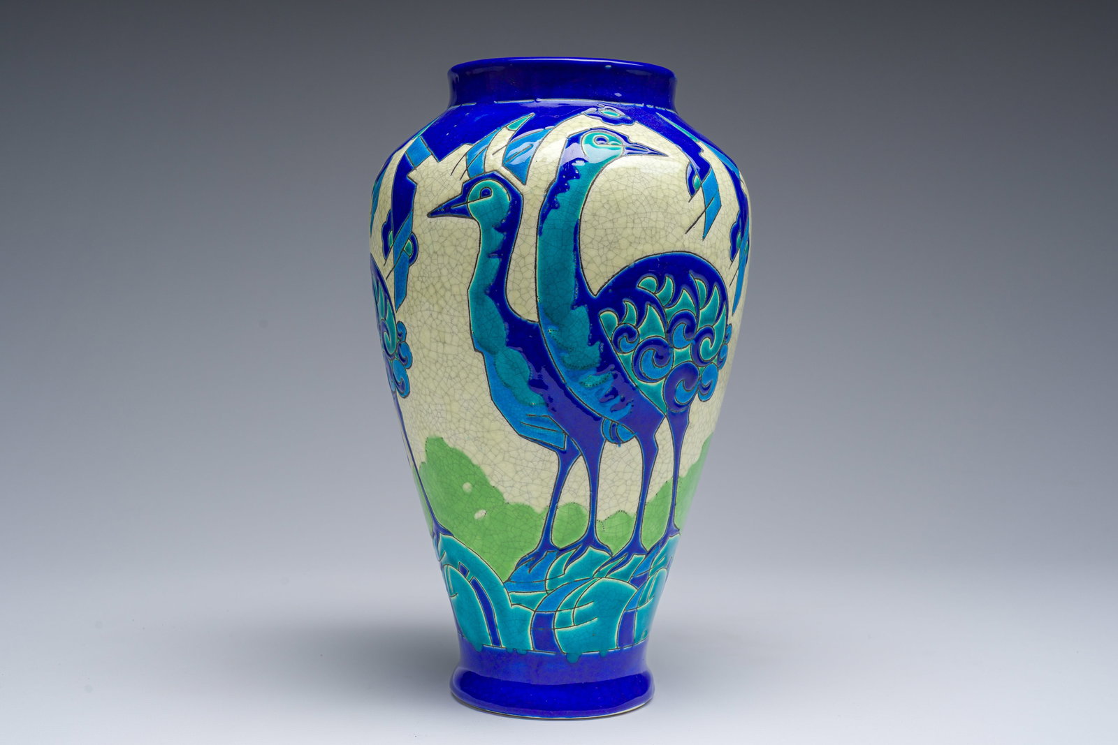 A rare polychrome Art Deco 'emus' or 'stylized birds' vase, Charles Catteau for Boch Kéramis,: A rare polychrome Art Deco 'emus' or 'stylized birds' vase, Charles Catteau for Boch Kéramis, second quarter 20th C. H 30,5 cm Ref.: -A vase of similar design (D.1506) isillustrated inthe book Art De