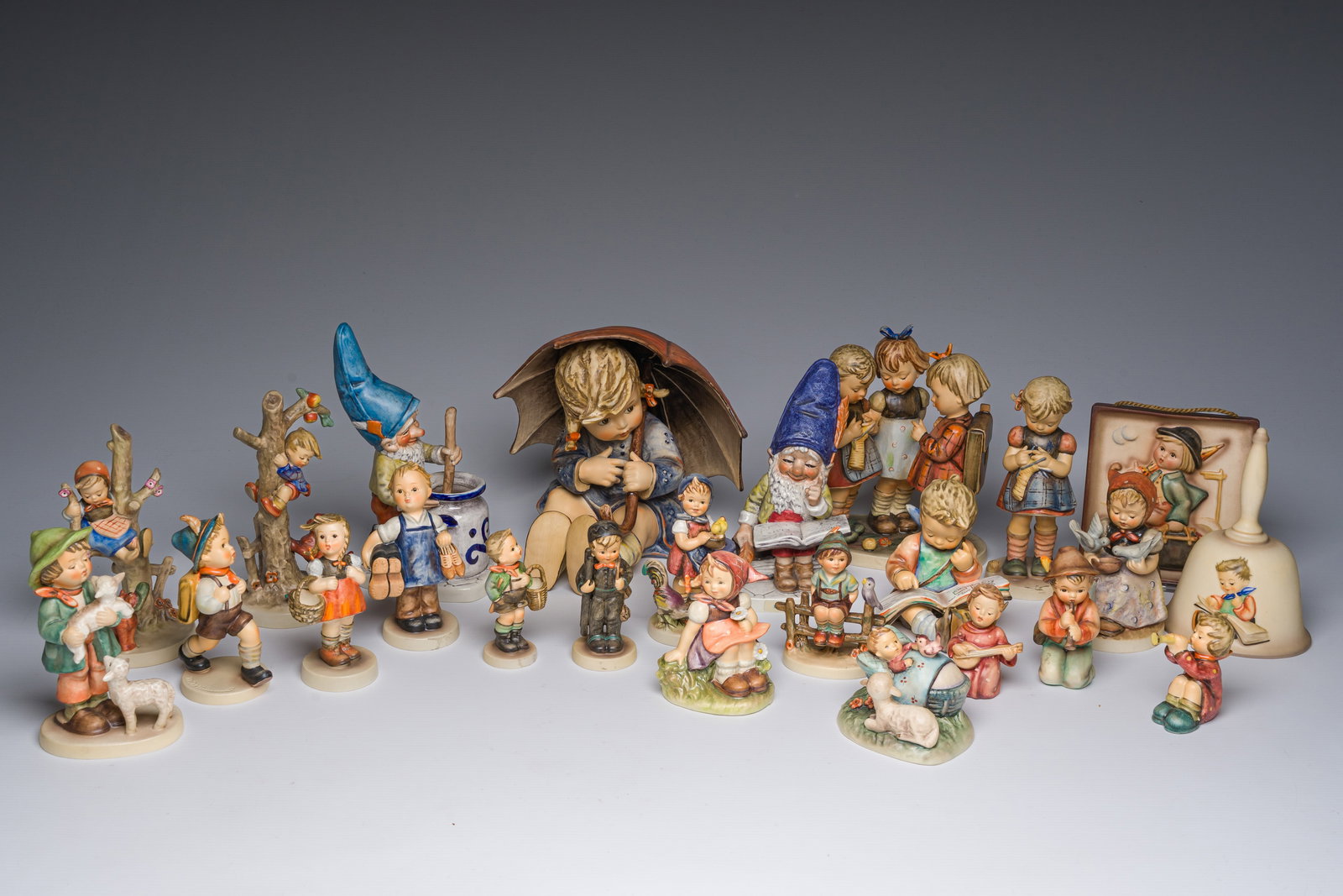 A large and varied collection of polychrome decorated biscuit Hummel figures and groups, Goebel,: A large and varied collection of polychrome decorated biscuit Hummel figures and groups, Goebel, Germany, 20th C. H 20,5 cm (the tallest figure)