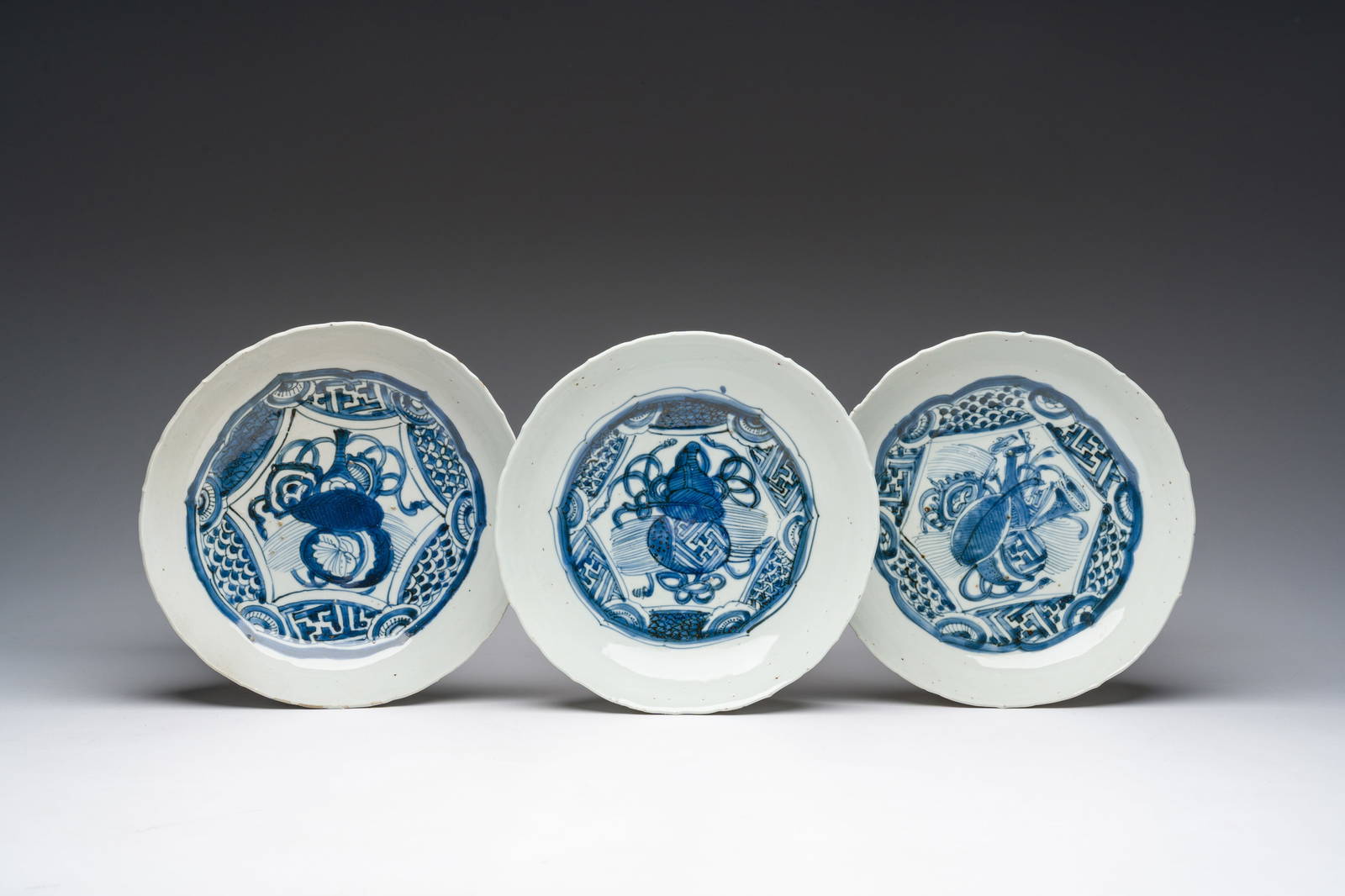 Three Chinese blue and white molded Kraak porcelain plates with double gourd designs, Wanli