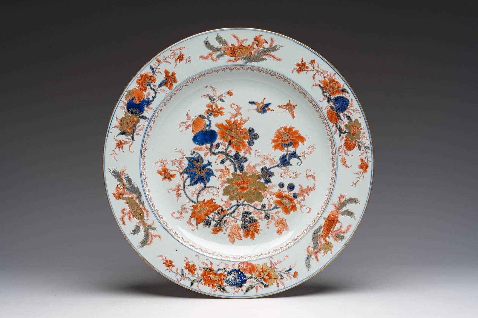 A Chinese Imari style dish with flowers, butterflies and carps, Kangxi