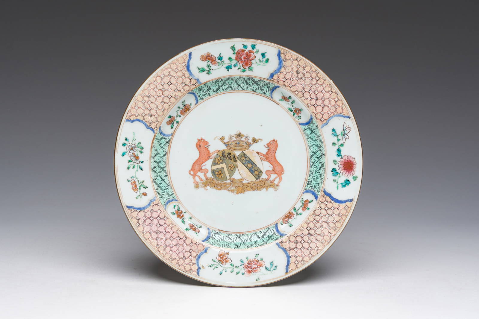 A Chinese armorial dish with the coat of alliance of Boudaen Courten and Boudaert for the Dutch
