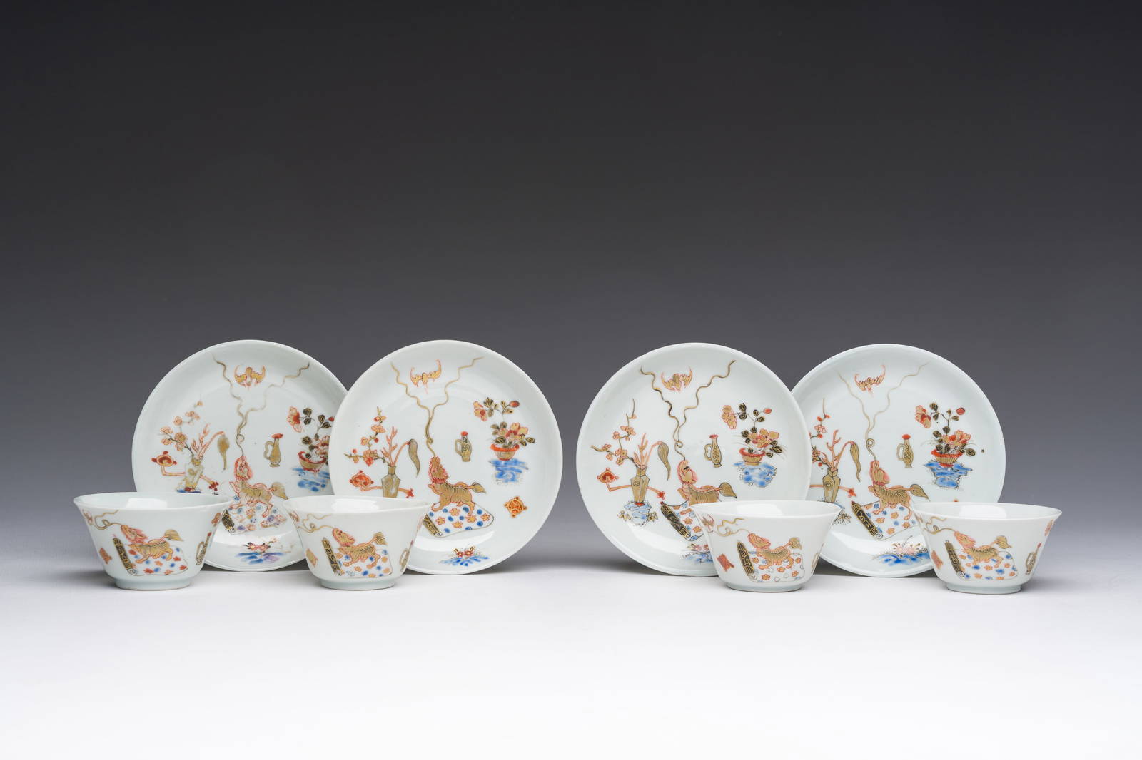 Four Chinese cups and saucer with polychrome and gilt design, Qianlong