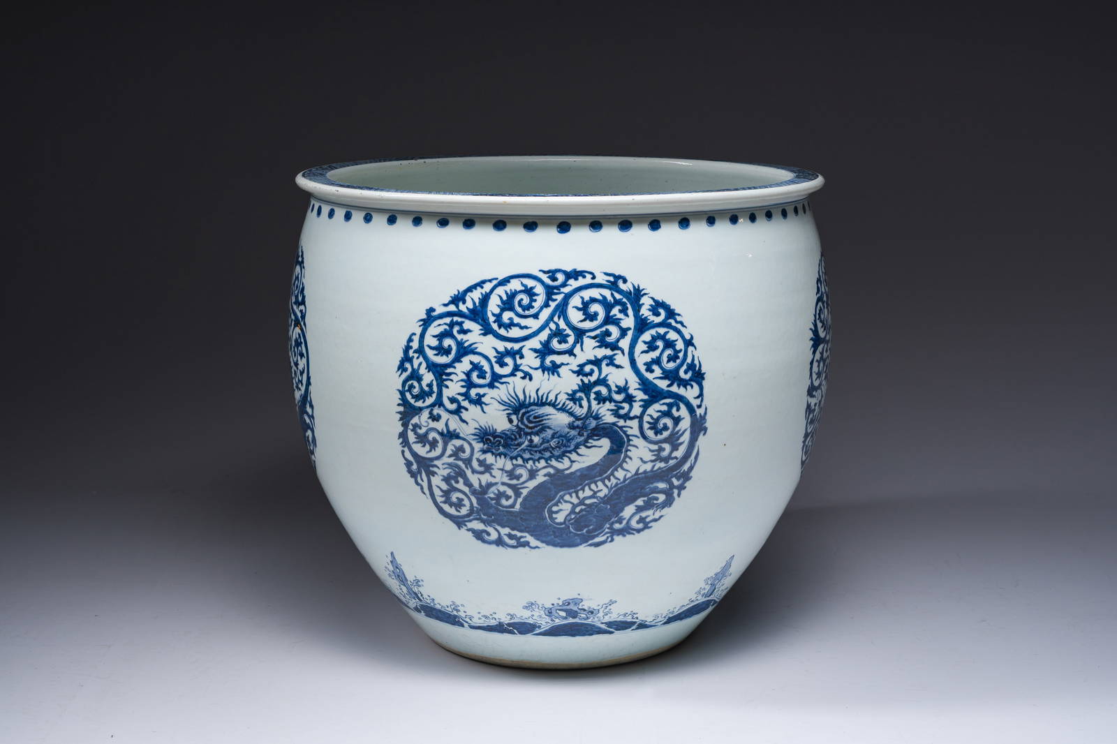 A large Chinese blue and white 'dragon medallion' fish bowl, Qianlong