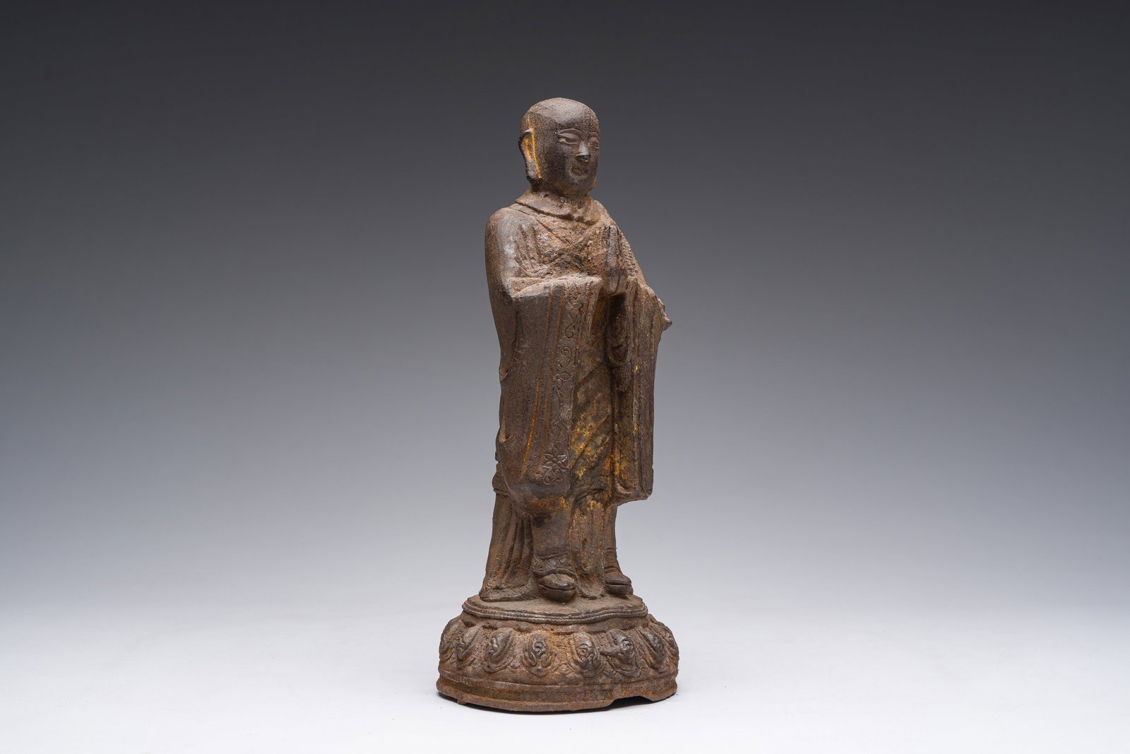 A Chinese cast iron sculpture of a Luohan, probably Ming: A Chinese cast iron sculpture of a Luohan, probably Ming H 27,5 cm