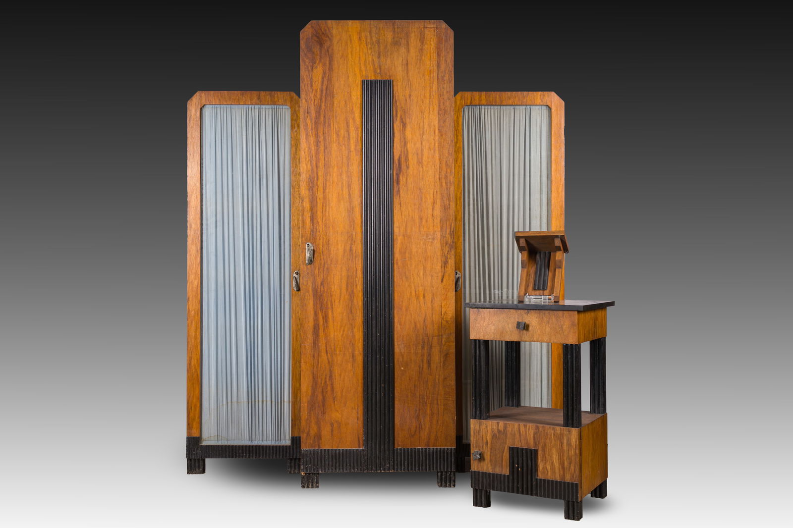 Joseph De Bruycker (1891-1942, attributed to): A mahogany Art Deco or Modern bookcase, a bookcase: Joseph De Bruycker (1891-1942, attributed to): A mahogany Art Deco or Modern bookcase, a bookcase rack and a console, De Coene, Kortrijk, ca. 1925 H 196,5 - L 169 - D 62,5 cm (the bookcase)H 78,5 - L