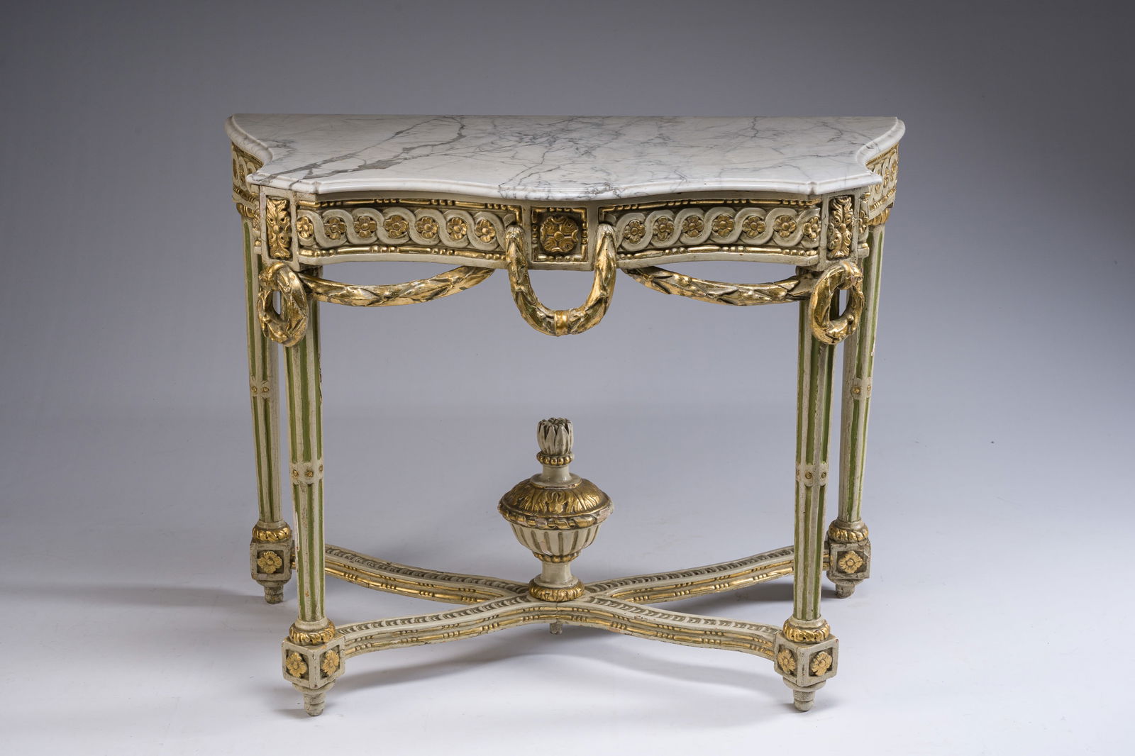 A parcel-gilt and polychromed wooden marble-topped console table in Louis XVI style, 19th C. (1 of 7)