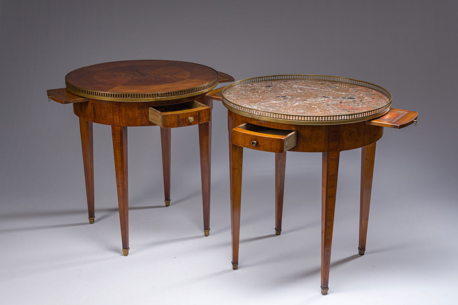 Two French Louis XVI style marquetry bouillotte tables with a brass gallery, one with a wooden and (1 of 7)