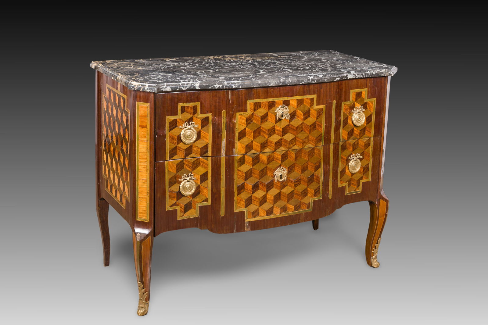 A French parquetry chest of drawers with gilt bronze mounts and grey marble top, 18th C.: A French parquetry chest of drawers with gilt bronze mounts and grey marble top, 18th C. H 85 - L 112,5 - D 57 cm