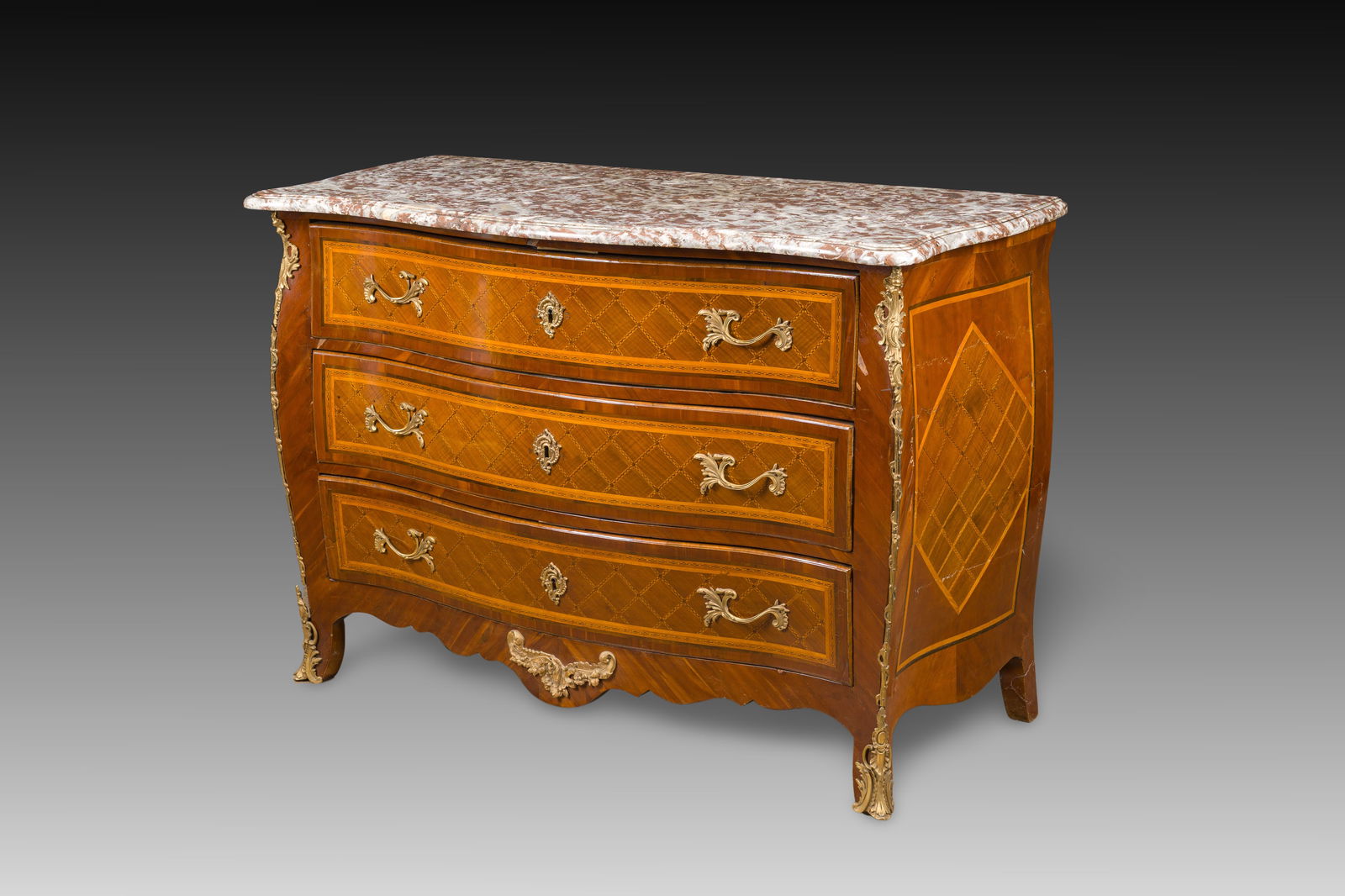 François Mondon (1694-1770): A Louis XV marquetry chest of drawers with gilt bronze mounts and red: François Mondon (1694-1770): A Louis XV marquetry chest of drawers with gilt bronze mounts and red marble top H 94 - L 135 - D 64,5 cm Stamped MONDON and with jurande mark to the two front corners, b