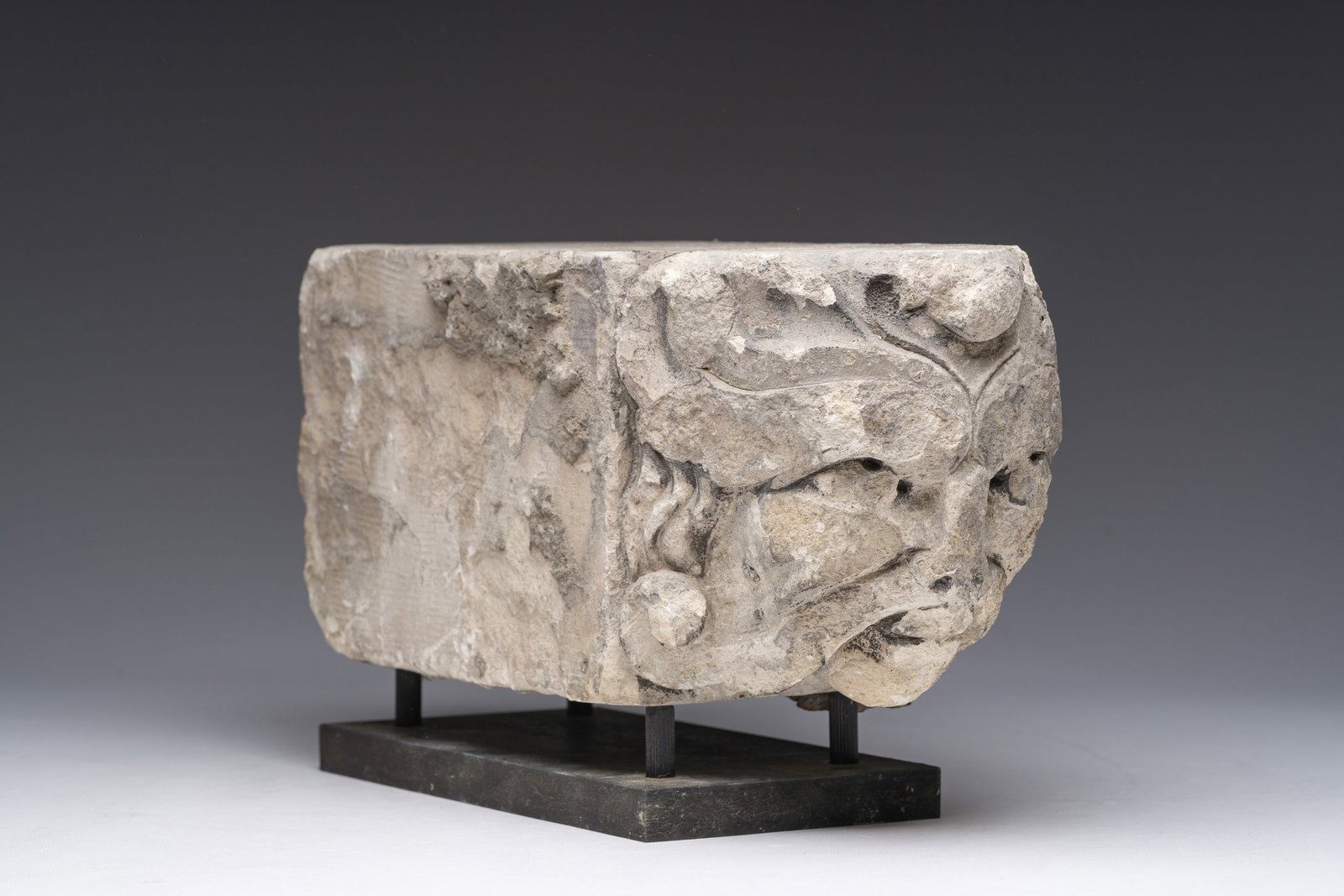 A Romanesque carved stone corbel with a grotesque head, probably France, 14th/15th C. (1 of 9)