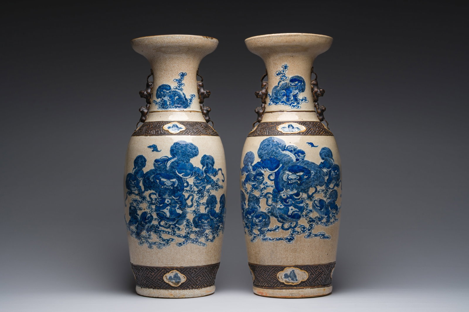A pair of Chinese Nanking crackle glazed blue and white vases with Buddhist lions and birds among (1 of 6)