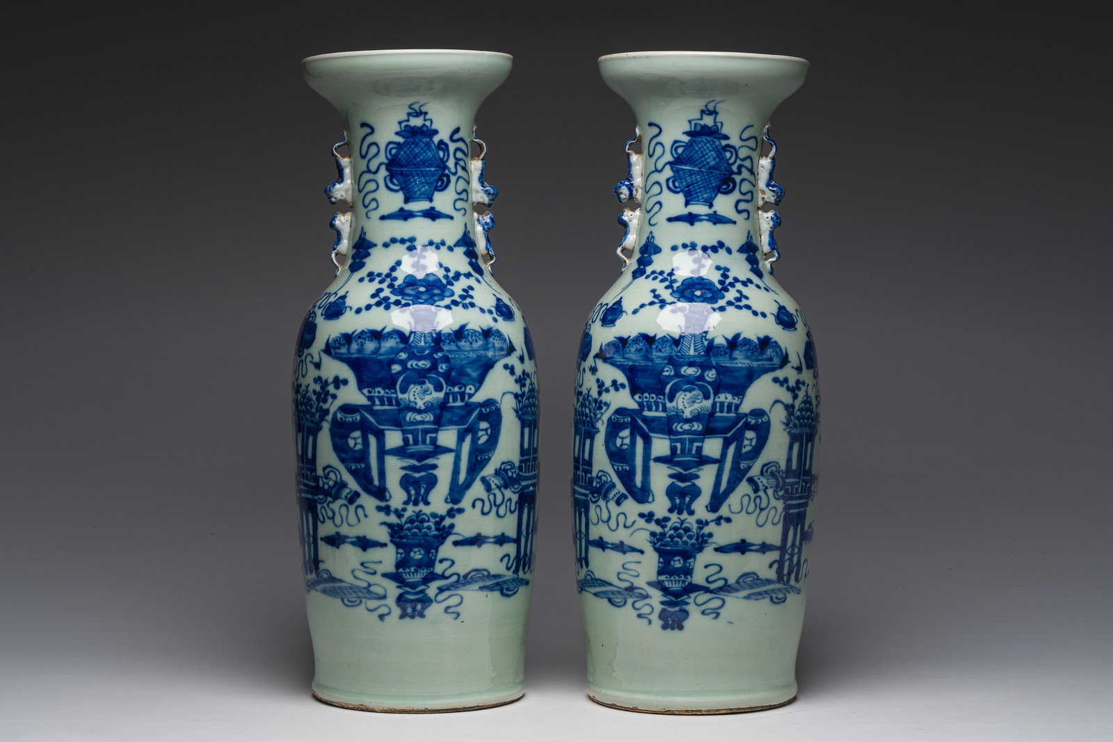 A pair of Chinese blue and white celadon ground 'antiquities' vases, 19th C. (1 of 7)