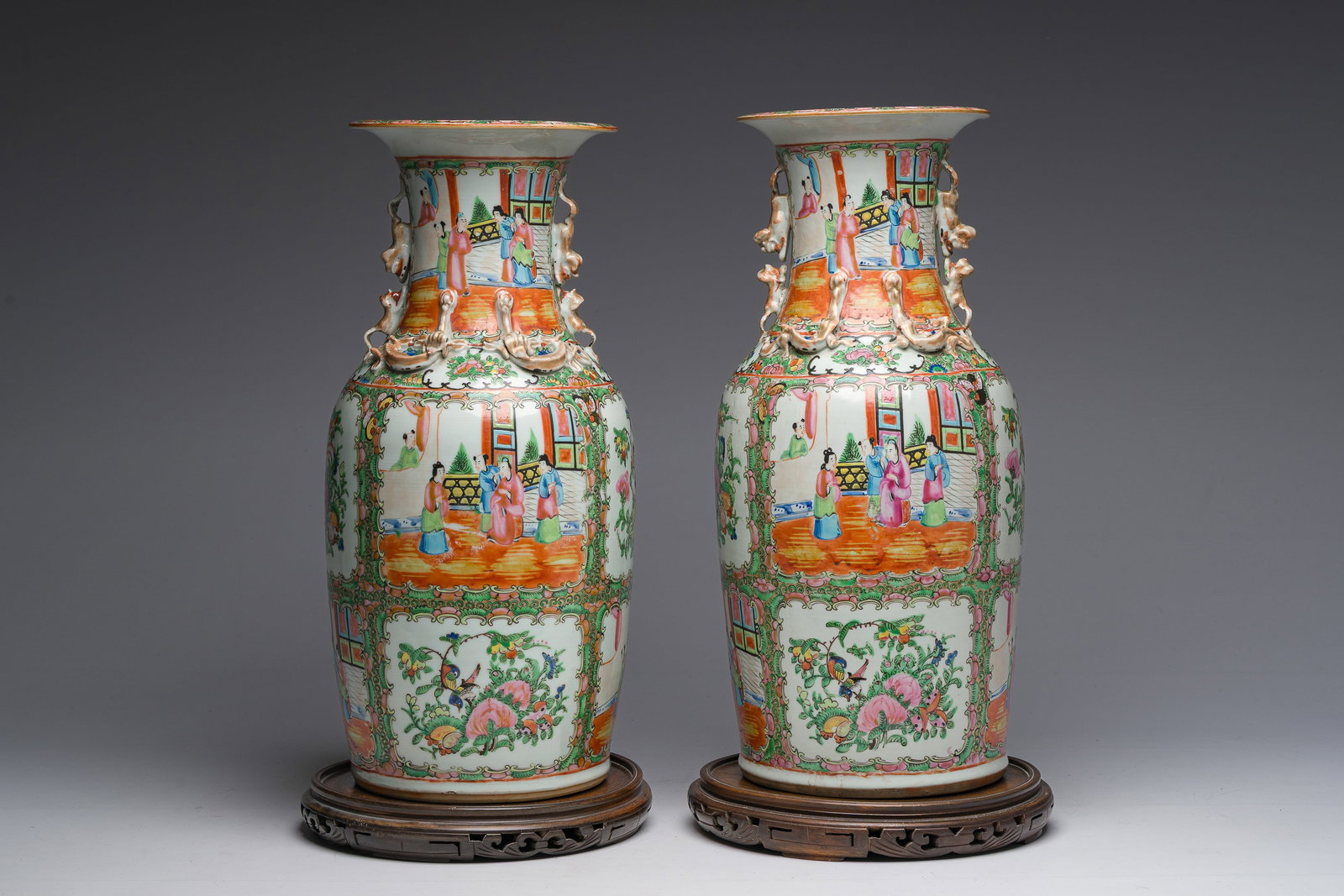 A pair of Chinese Canton famille rose vases with palace scenes and floral design, 19th C. (1 of 9)