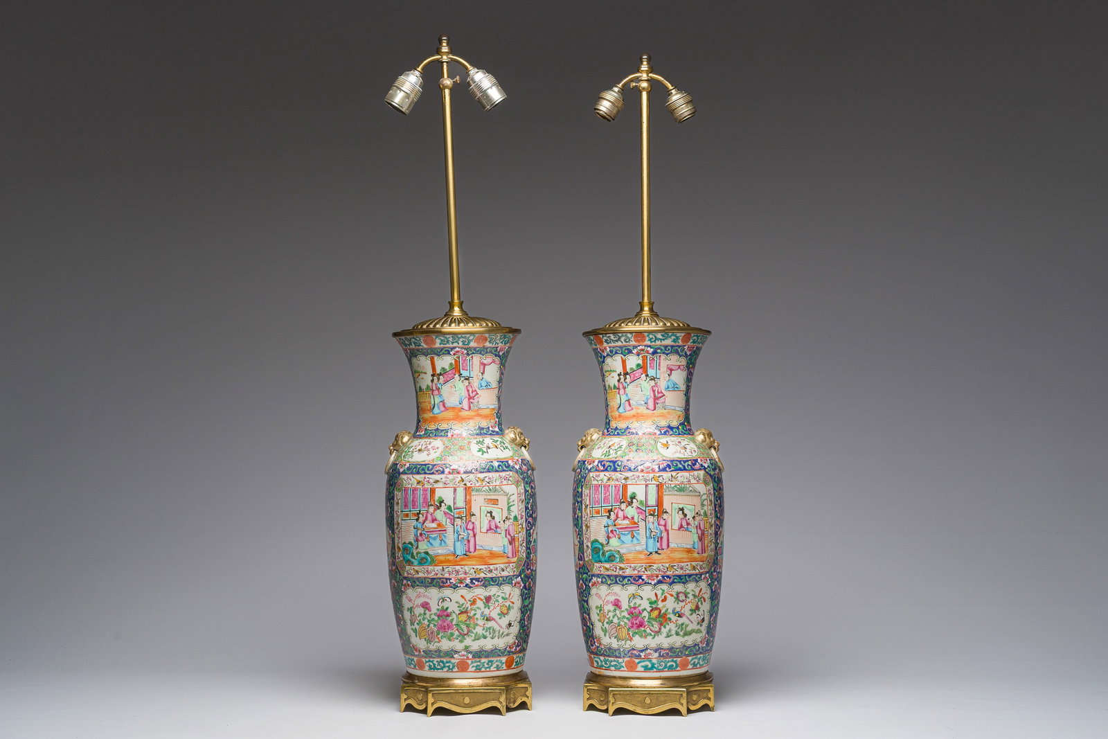 A pair of Chinese Canton blue-ground famille rose vases with palace scenes and floral design mounted (1 of 8)