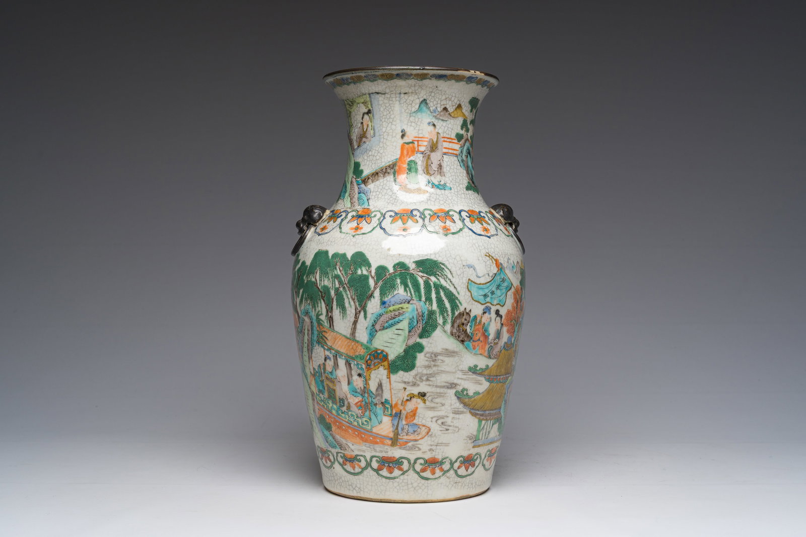 A Chinese Nanking crackle glazed famille verte vase with an animated scene all around, 19th C. (1 of 6)
