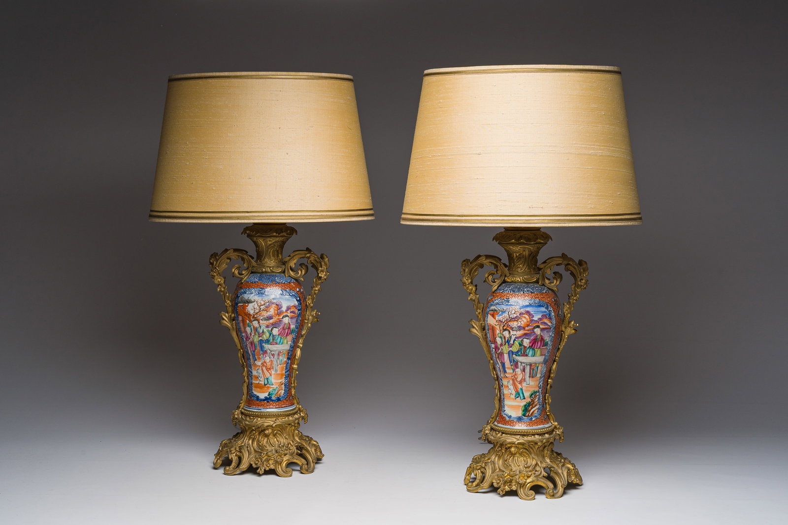 A pair of Chinese gilt bronze lamp mounted famille rose 'Mandarin' vases, Qianlong (1 of 9)
